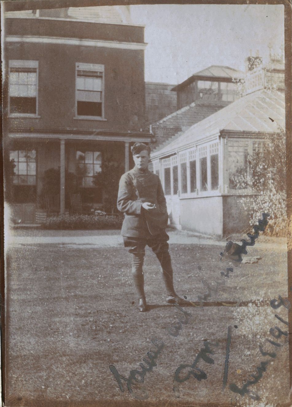 Man in uniform, possibly Ross, in grounds of 'Homemead' Lymington, 1918, signed but smudged in bottom right hand corner, June 1918