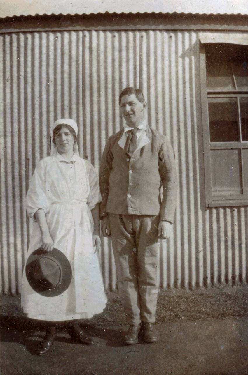 Nurse standing with man, Tin Town, Brockenhurst, 1918