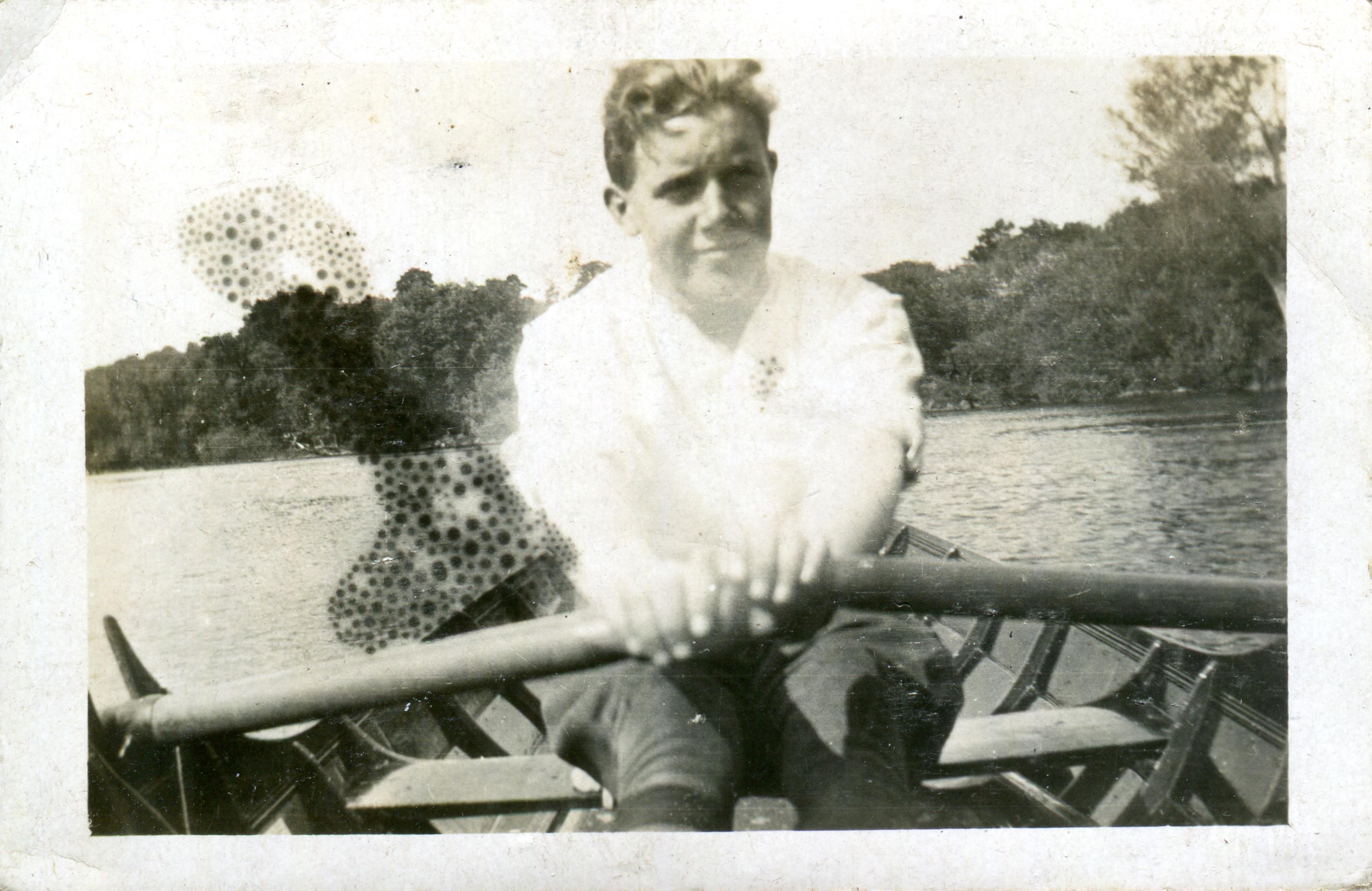 Young man rowing a boat