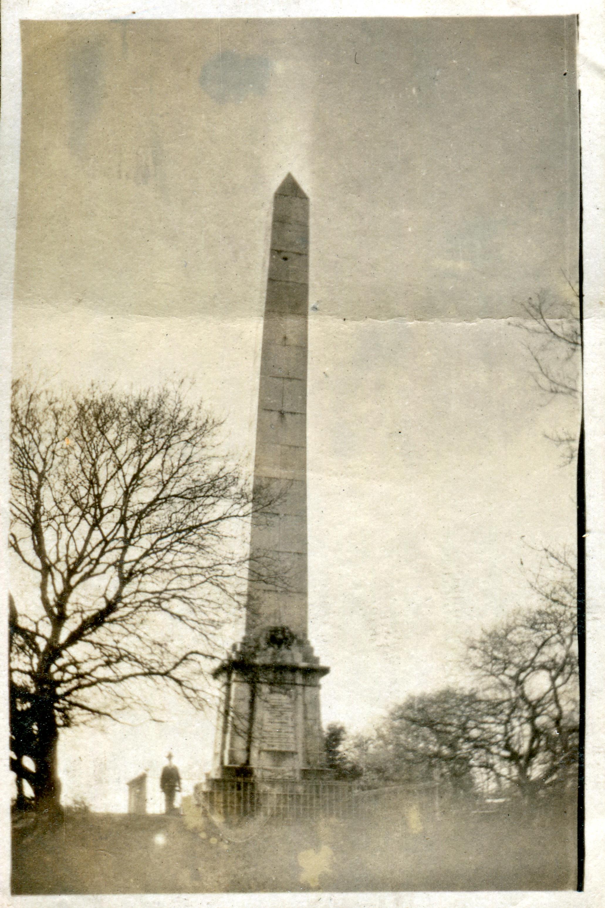 Man standing beneath Sir Harry Burrard Neale Monument
