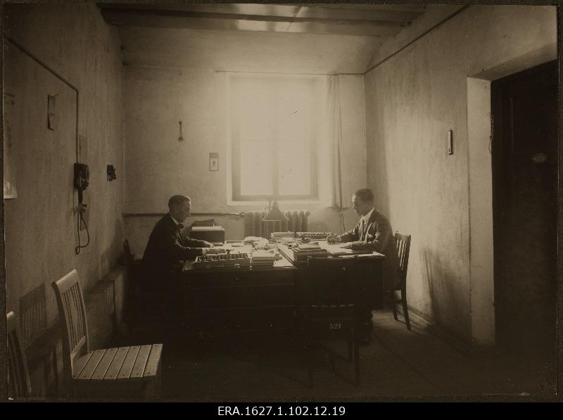 Warehouse workers behind the desk