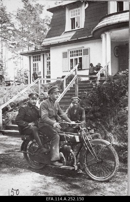 War of Liberty. 6th Battalion Commander of the 4th Battalion Valter Bergmann (Valdo Mäeste) in front of the battalion headquarters (villa Auguste) in the Rodenpoisi (Ropaži) motorcycle Sunbeam. In the back seat unknown subordinate.