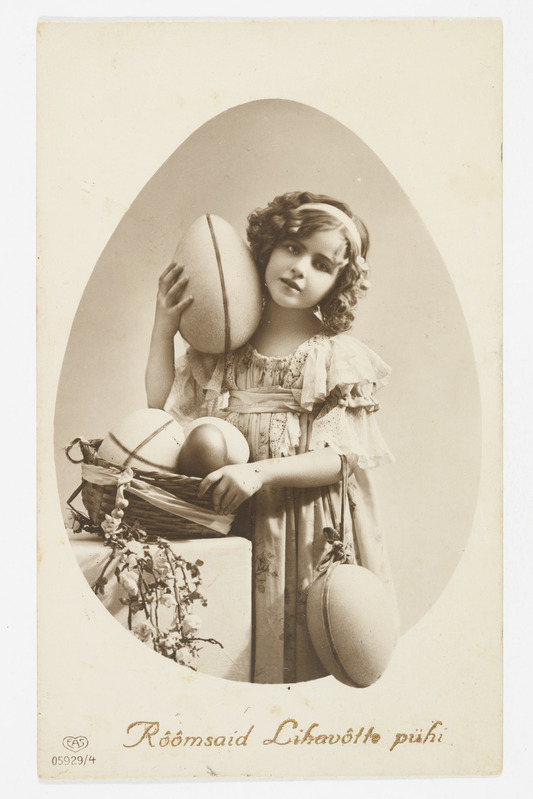 Lihavõttekaart munakorviga tüdrukuga ning tekstiga "Rõõmsaid Lihavõtte pühi!"