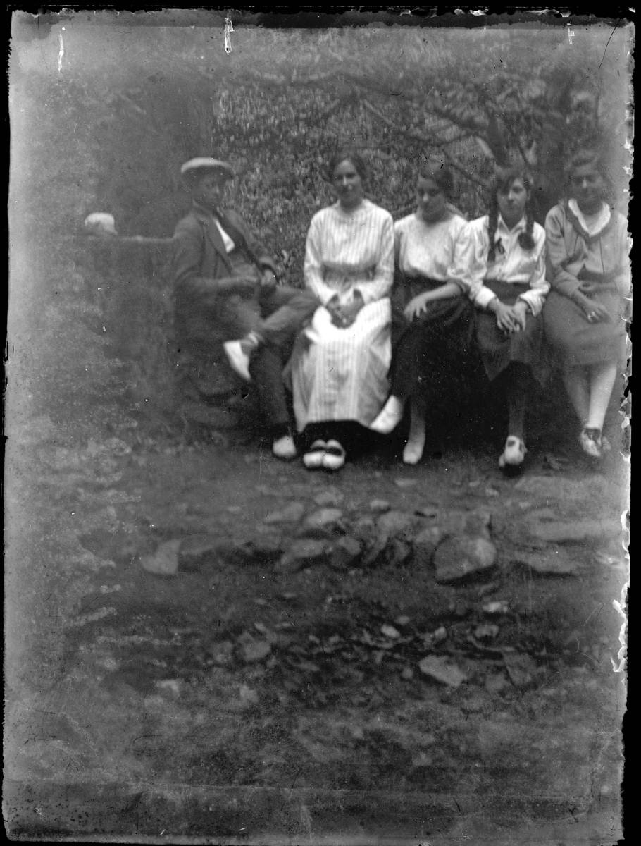 [Portrait] - Group sitting in a quarry.