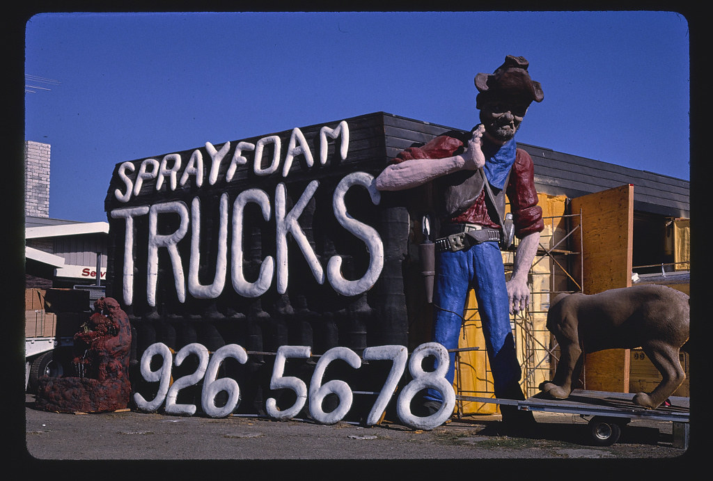 Spray foam trucks prospector statue and sign, overall view, Frontage Road, I-5, Albany, Oregon (LOC)