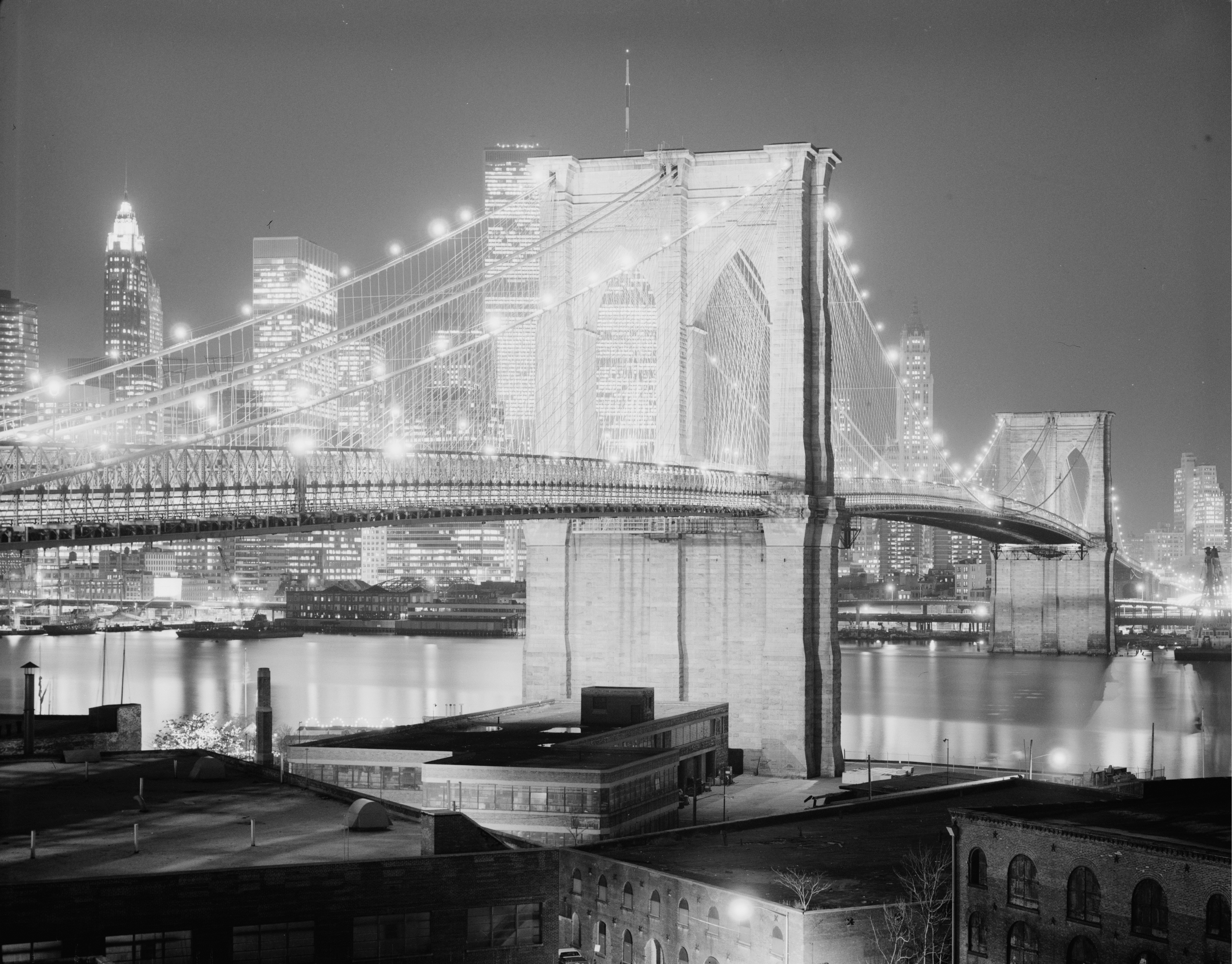 Brooklyn Bridge night lighted 1982 - Night view of the Brooklyn Bridge, looking northwest, bridge lighted. Historic American Engineering Record, Library of Congress, Washington, D. C.