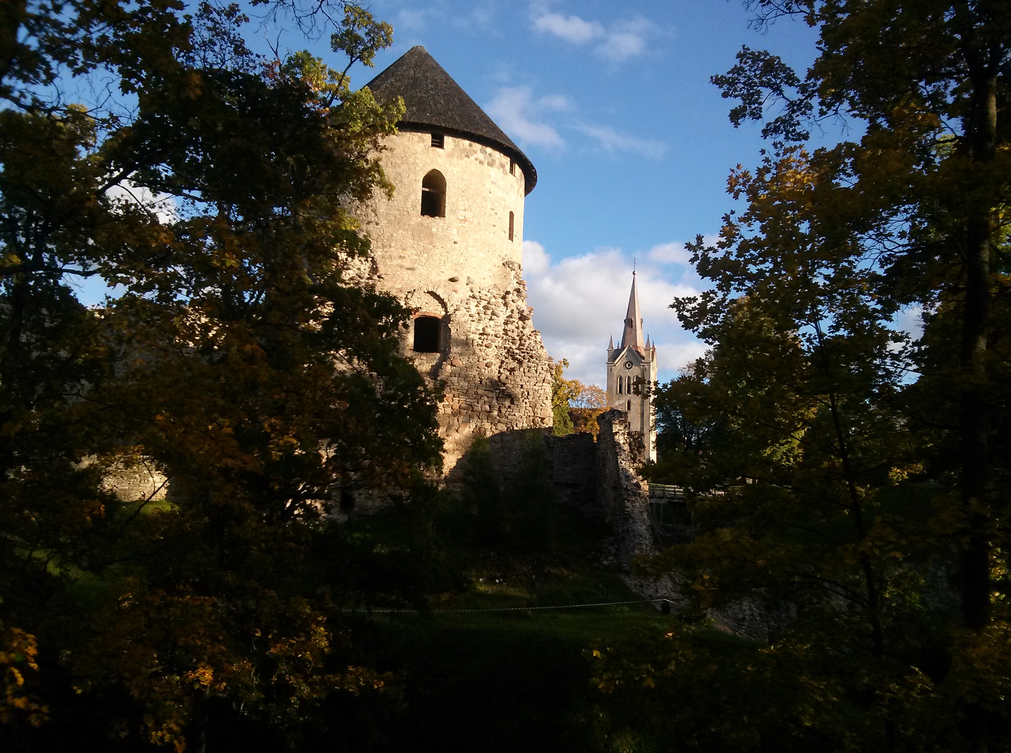 Cēsis Castle west tower and St. John's church in the background - This is a photo of cultural heritage monument of Latvia number