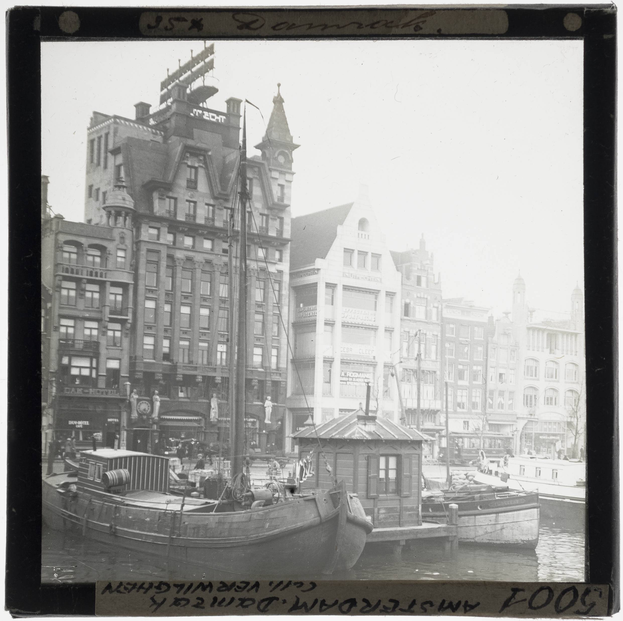 Amsterdam. Damrak Sailboats in the water, near the office building The Utrecht - KU Leuven. Glass slides landscape, architecture and design. Université de Louvain, between 1839 and 1939. Photographer unknown. Added information on slide. Creation/Construction: 1905-1906 (office building De Utrecht). Current location: Netherlands, Amsterdam. EuroPhot. Art History. 20th century. Architecture. Building. EuroPhot. Art history. 20th century. Architecture. Building. EuroPhot. Social history. 20th century. Architecture. Building. EuroPhot. Social history. 20th century. Architecture. Building.