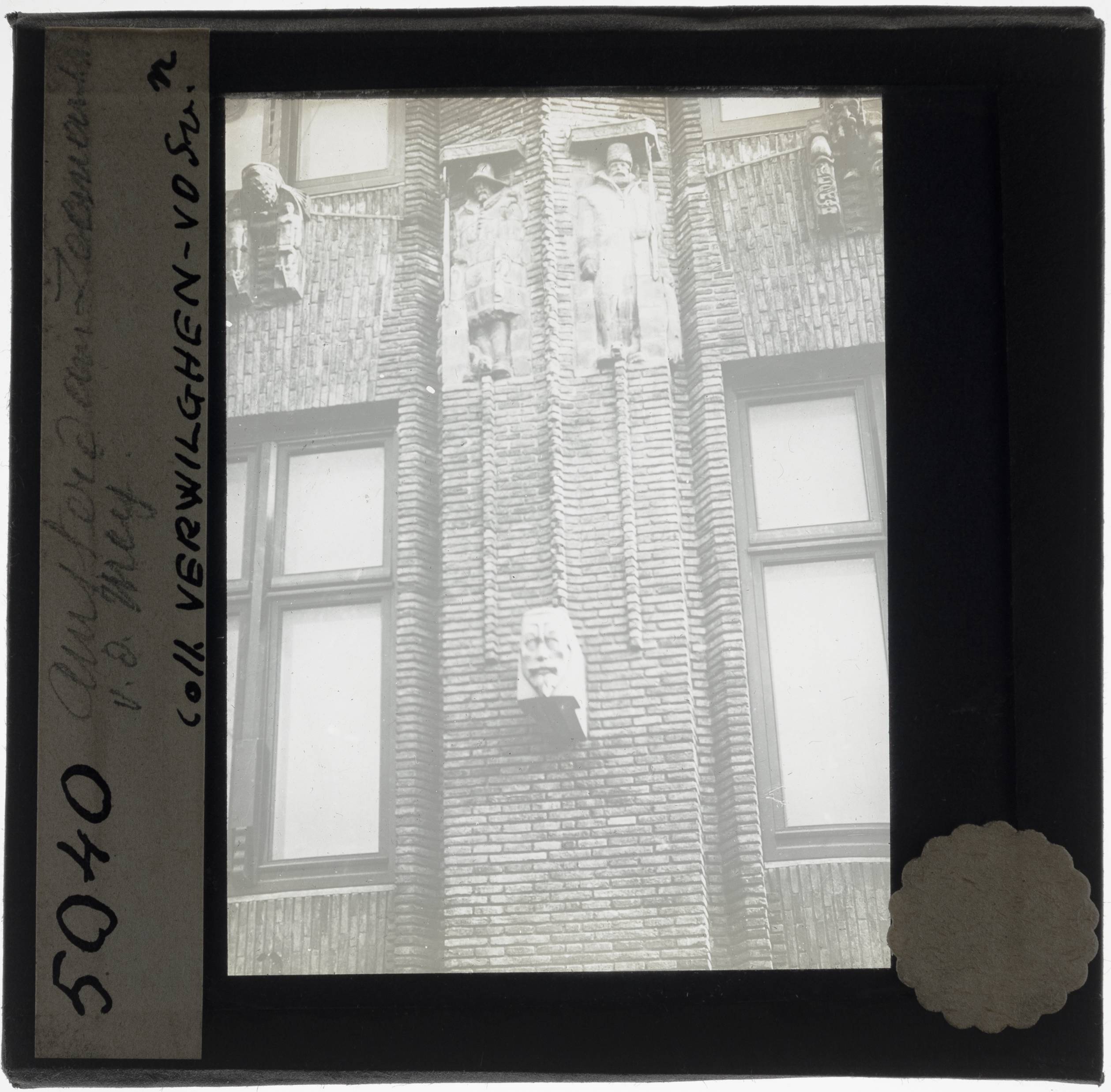 Amsterdam. Shipping house Detail: Terracotta facade plastics and a sculpted portrait - KU Leuven. Glass slides landscape, architecture and design. Université de Louvain, between 1839 and 1939. Photographer unknown. Added information on slide. Movement/Style: Amsterdam School. Creation/Building: 1913-1916, 1926-1928. Current location: Netherlands, Amsterdam, Prins Hendrikkade. EuroPhot. Art History. 20th century. Architecture. Architectural element. EuroPhot. Art history. 20th century. Architecture. Architectural element. EuroPhot. Social history. 20th century. Architecture. Architectural element. EuroPhot. Social history. 20th century. Architecture. Architectural element.