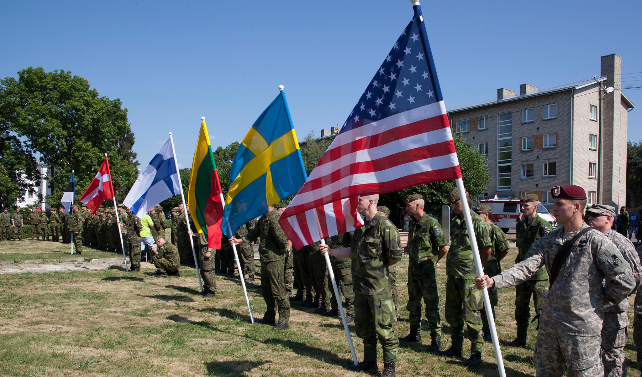 Estonia's Admiral Pitka Recon Challenge - NATO soldiers from Estonia, Denmark, Finland, Lithuania, Sweden and the United States present their countries’ colors (or flags) during the opening ceremony of the second annual Admiral Pitka Recon Challenge Aug. 5 at Rakvere, Estonia. Hosted by the Estonian Defense League and including Soldiers from the 173rd Airborne Brigade and the Maryland National Guard, this three-day competition tested the strength, speed, endurance, intelligence and willpower of 26 teams from six countries through a series of obstacles and simulations along an 81-mile route through Estonia’s countryside. Paratroopers with the 173rd Abn. Bde. are deployed for training in Estonia as part of Operation Atlantic Resolve, an exercise dedicated to demonstrating commitment to NATO obligations and sustaining interoperability with allied forces. The Maryland National Guard and Estonian armed forces have been partners through the State Partnership Program for more than 20 years.