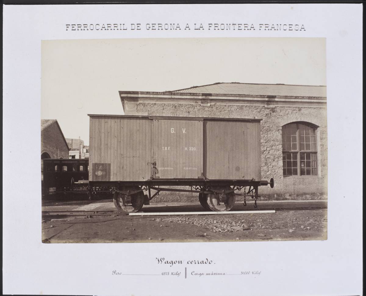 Railway from Gerona to the French Border. Vagon cerrado - Closed railroad waggon from Girona to France stopped at a station