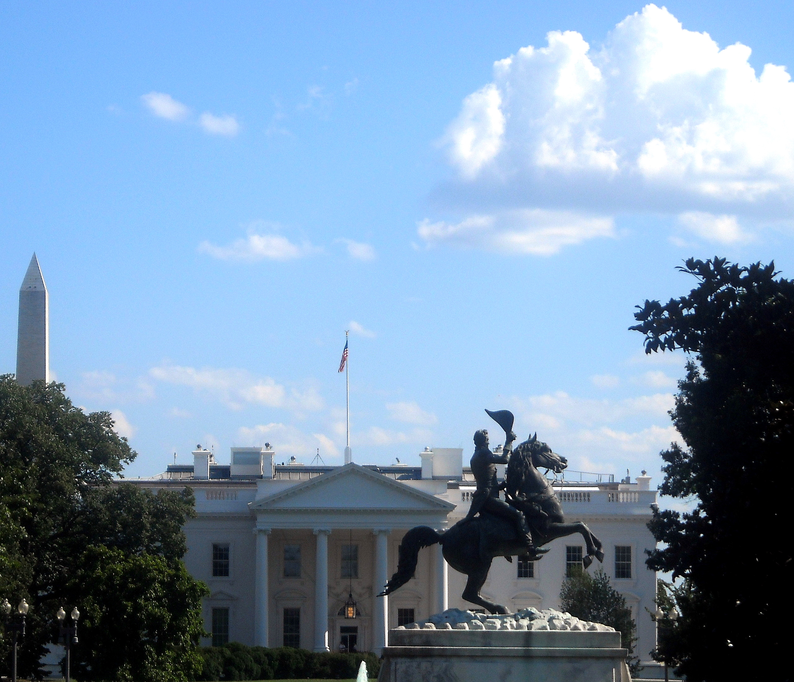 Andrew Jackson statue, White House, Washington Monument - The equestrian sculpture of Andrew Jackson (1852, Clark Mills) located in Lafayette Square in Washington, D.C.  The sculpture is designated as a contributing property to the Lafayette Square Historic District, which was declared a National Historic Landmark in 1970.  The White House and the Washington Monument are visible in the background.