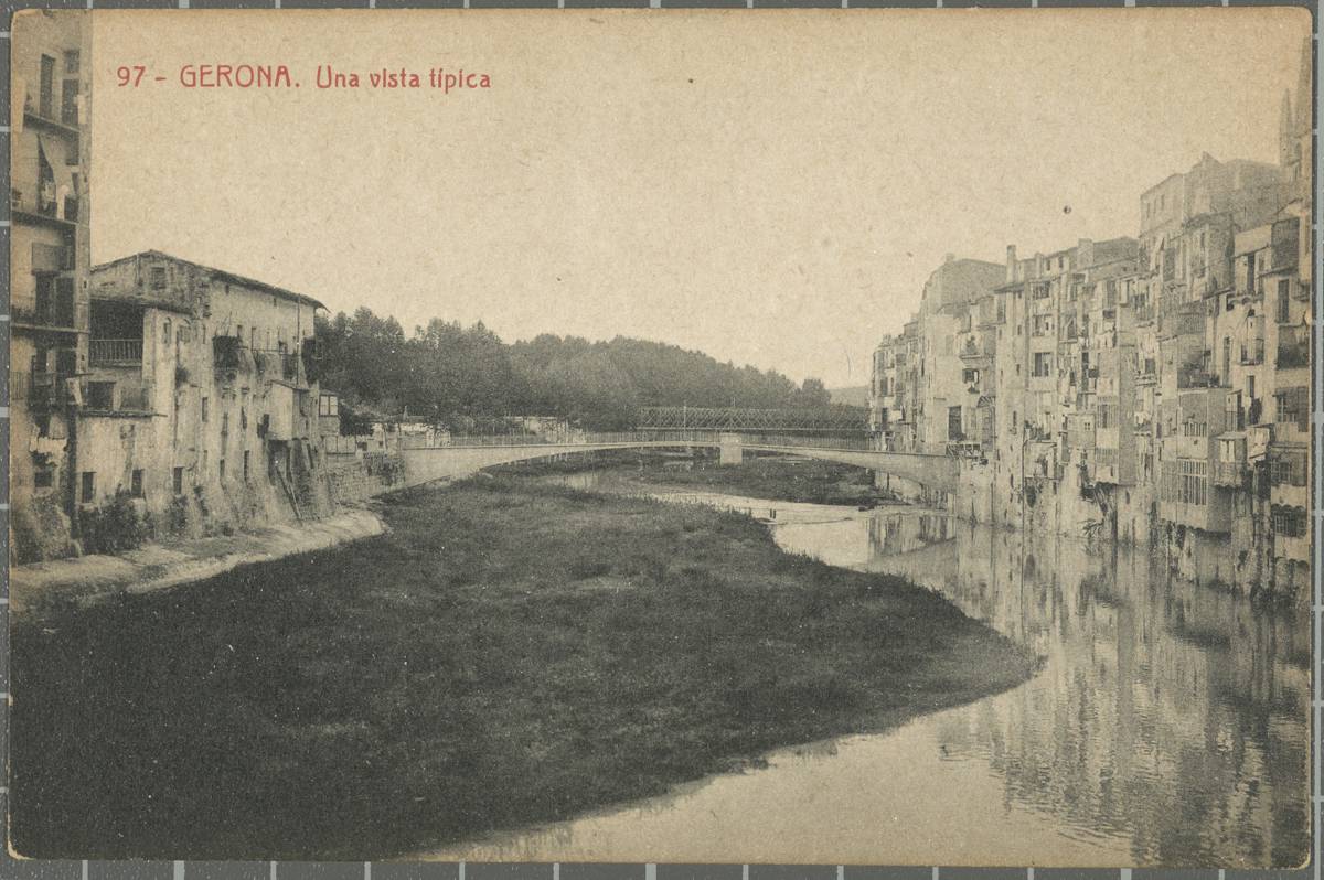97-Gerona. A typical view - View of the Onyar River at the height of the Gomez bridge with the houses of La Onyar on the right. In the background, the Railway Bridge