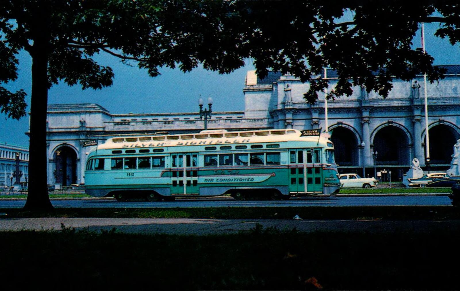 Silver Sightseer PCC trolley in 1960 - "This car had to be one of the most outstanding PCC cars in operation anywhere. Originally built by St. Louis Car Co. in 1945, the car saw several rebuildings and renumberings. In 1957 the car was revamped into a special car known as the "Silver Sightseer" for touring our Nation's Capitol. It even boasted a lovely hostess to narrate the trip. 1512 is shown here passing Union Station, Washington, D.C. August 28, 1960."