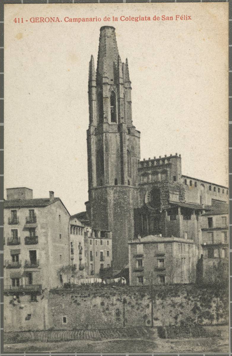 411 - Gerona. Campanario de la Colegiata de San Félix - The church of Sant Feliu seen from the other side of the river. You can see the bell tower, the baroque façade and the access staircase from the Plaza San Feliu and orchards planted in the bed of the river Onyar.