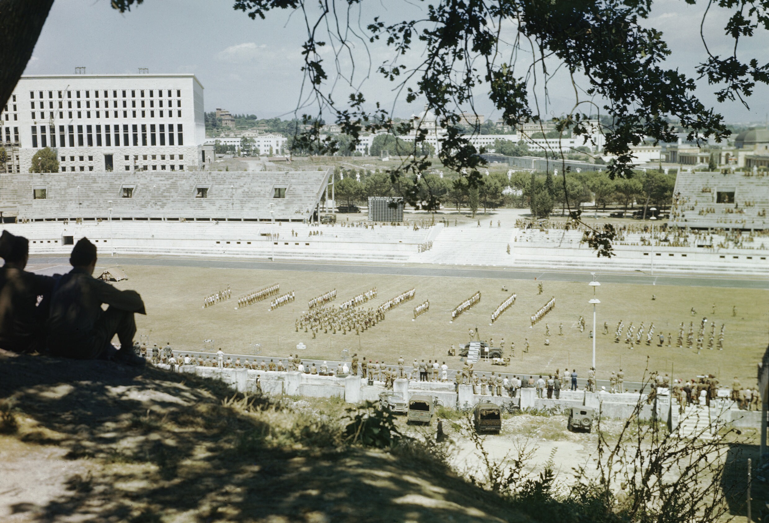 Allied Forces Sports Meeting at the Foro Italico, Formerly the Mussolini Forum, Rome, July 1944 TR2102 - Allied Forces Sports Meeting at the Foro Italico, Formerly the Mussolini Forum, Rome, July 1944
A view across the stadium with athletes in the centre of the track and the city in the background.