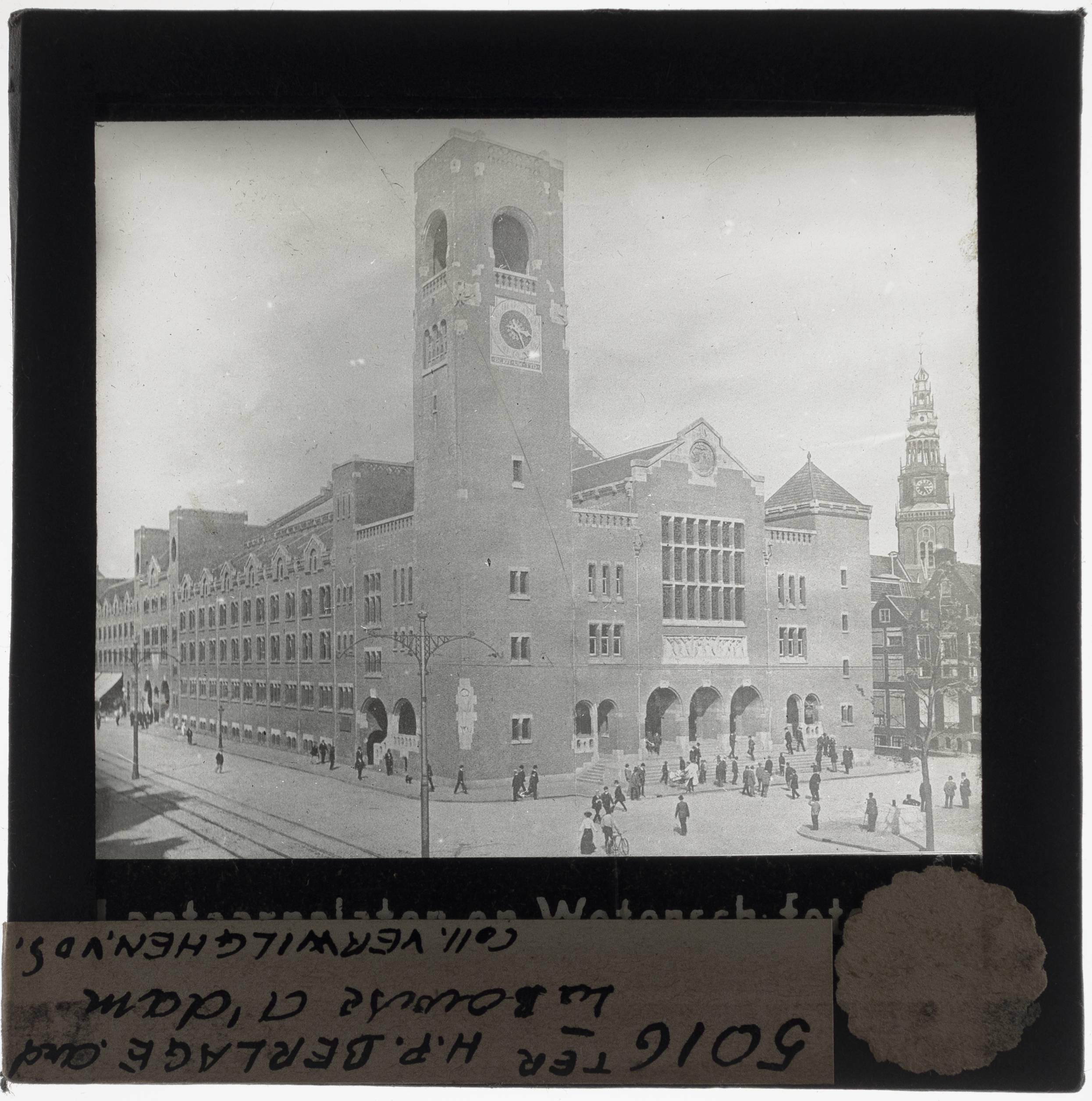 Amsterdam. Beurs van Berlage Exterior: View from the southwest - KU Leuven. Glass slides landscape, architecture and design. Université de Louvain, between 1839 and 1939. Photographer unknown. Added information on slide. Current location: Netherlands, Amsterdam, Damrak and Beursplein. Current/Methods: Rationalism. Creation/Building: 1898-1903. EuroPhot. Art History. 19th century. Architecture. Building. EuroPhot. Art history. 19th century. Architecture. Building. EuroPhot. Social history. 19th century. Architecture. Building. EuroPhot. Social history. 19th century. Architecture. Building.