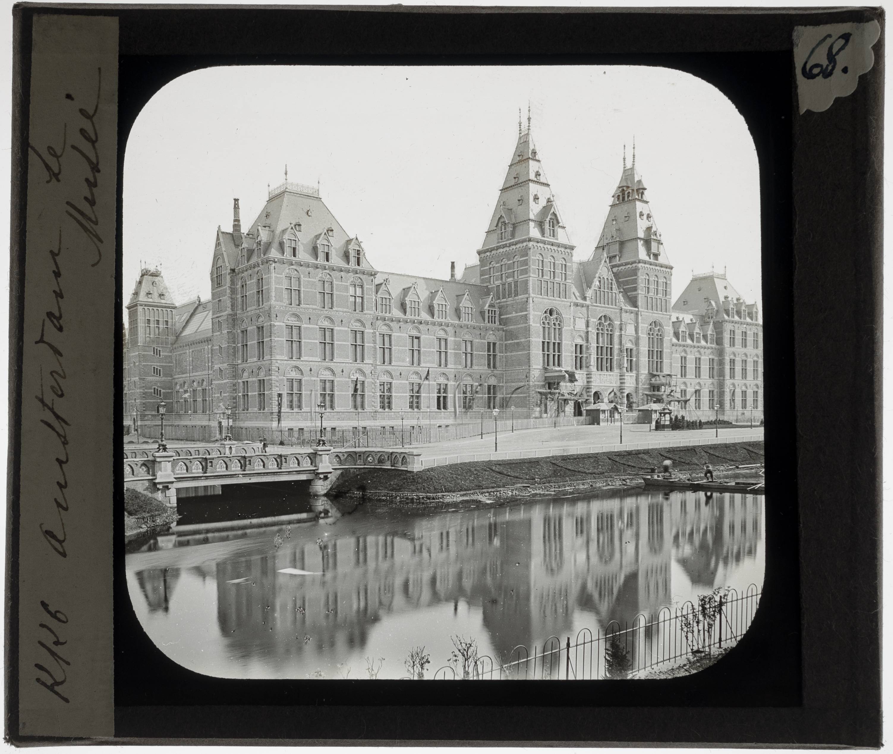 Amsterdam. Rijksmuseum Exterior: View from the Stadhouderskade - KU Leuven. Glass slides art history. Université de Louvain, between 1839 and 1939. Photographer unknown. Added information on slide. Movement/Style: Neo-Gothic. Creation/Building: 1876-1885. Current location: Netherlands, Amsterdam. EuroPhot. Art History. 19th century. Architecture. Building. EuroPhot. Art history. 19th century. Architecture. Building.