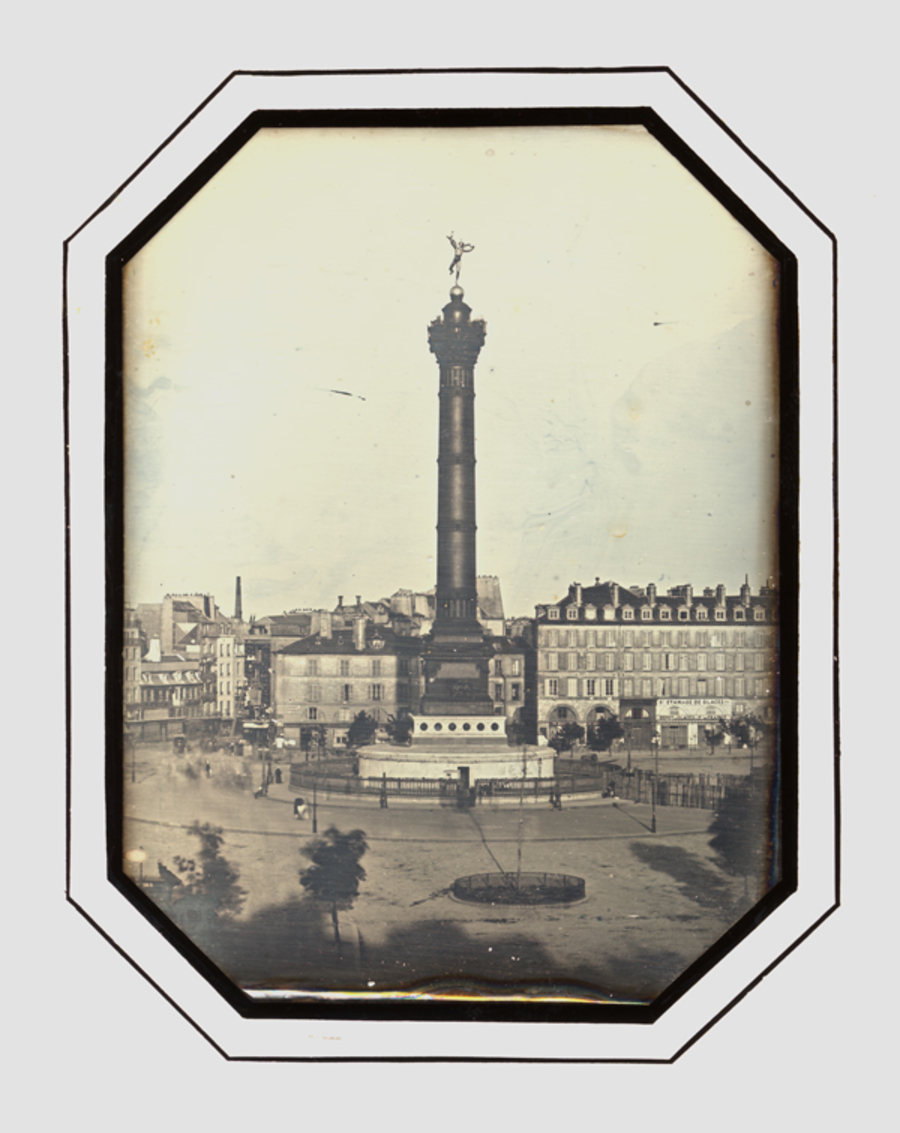 City scenery, view on a place with a large column and a statue on top of it  (Paris, Place de la Bastille, Colonne de Juillet)