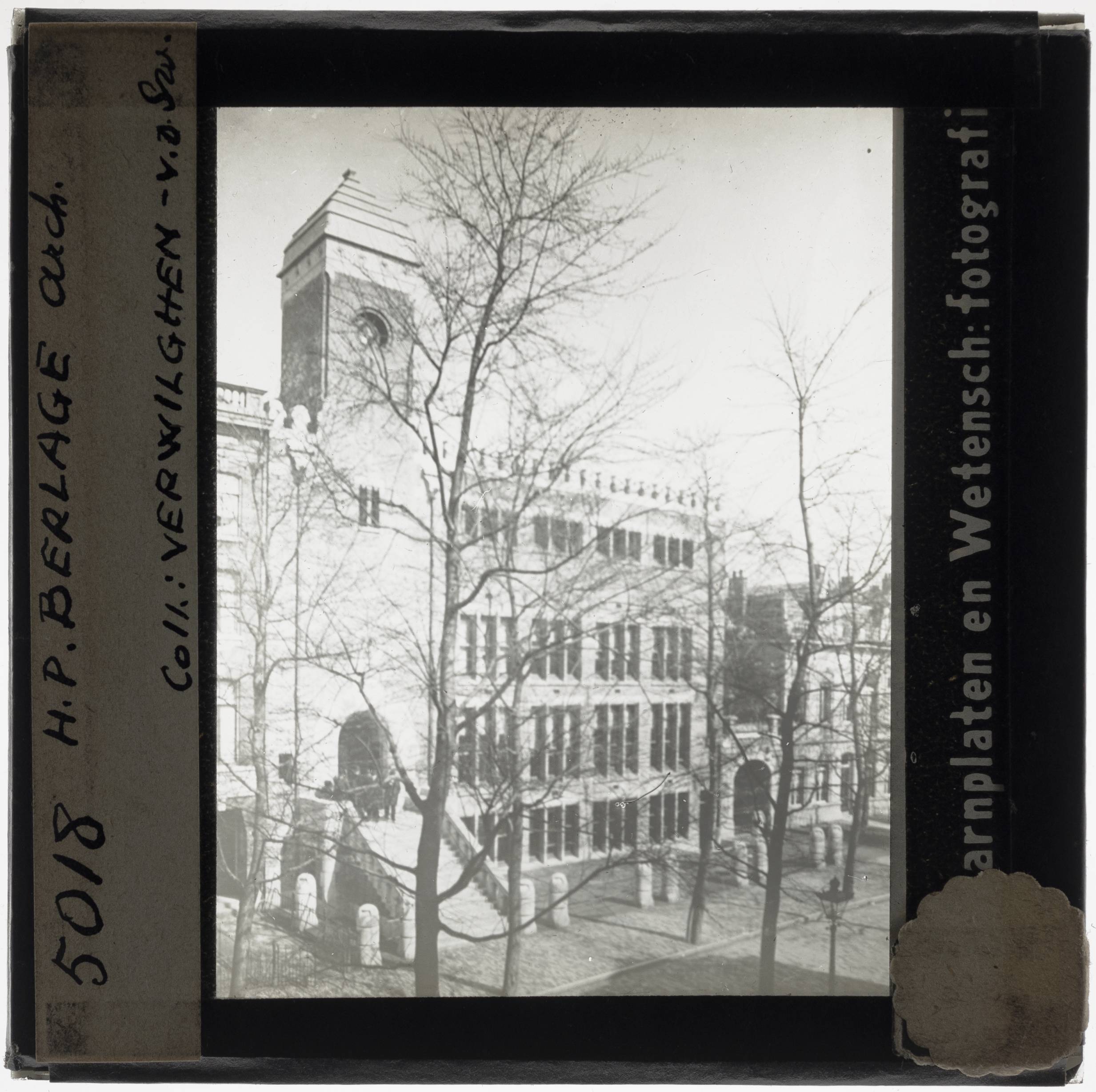 Amsterdam. De Burcht van Berlage' Exterior: Frontage - KU Leuven. Glass slides landscape, architecture and design. Université de Louvain, between 1839 and 1939. Photographer unknown. Added information on slide. Current location: Netherlands, Amsterdam, Henri Polaklaan 9. Current/Methods: Rationalism. Technique/Material: Brick. Creation/Building: 1899-1900. EuroPhot. Art History. 19th century. Architecture. Building. EuroPhot. Art history. 19th century. Architecture. Building. EuroPhot. Social history. 19th century. Architecture. Building. EuroPhot. Social history. 19th century. Architecture. Building.