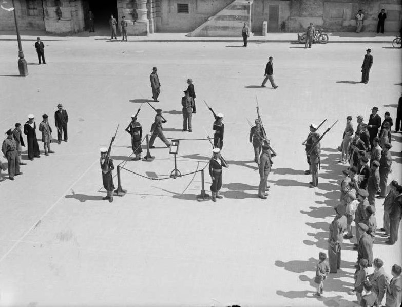 The Royal Navy during the Second World War A16223 - The Royal Navy during the Second World War
Maltese ratings changing guard with the King's Own Malta Regiment in Palace Square as the George Cross is ceremoniously displayed in Palace Square, Valletta on the first anniversary of Malta being awarded the George Cross by His Majesty King George VI on 15 April 1942.