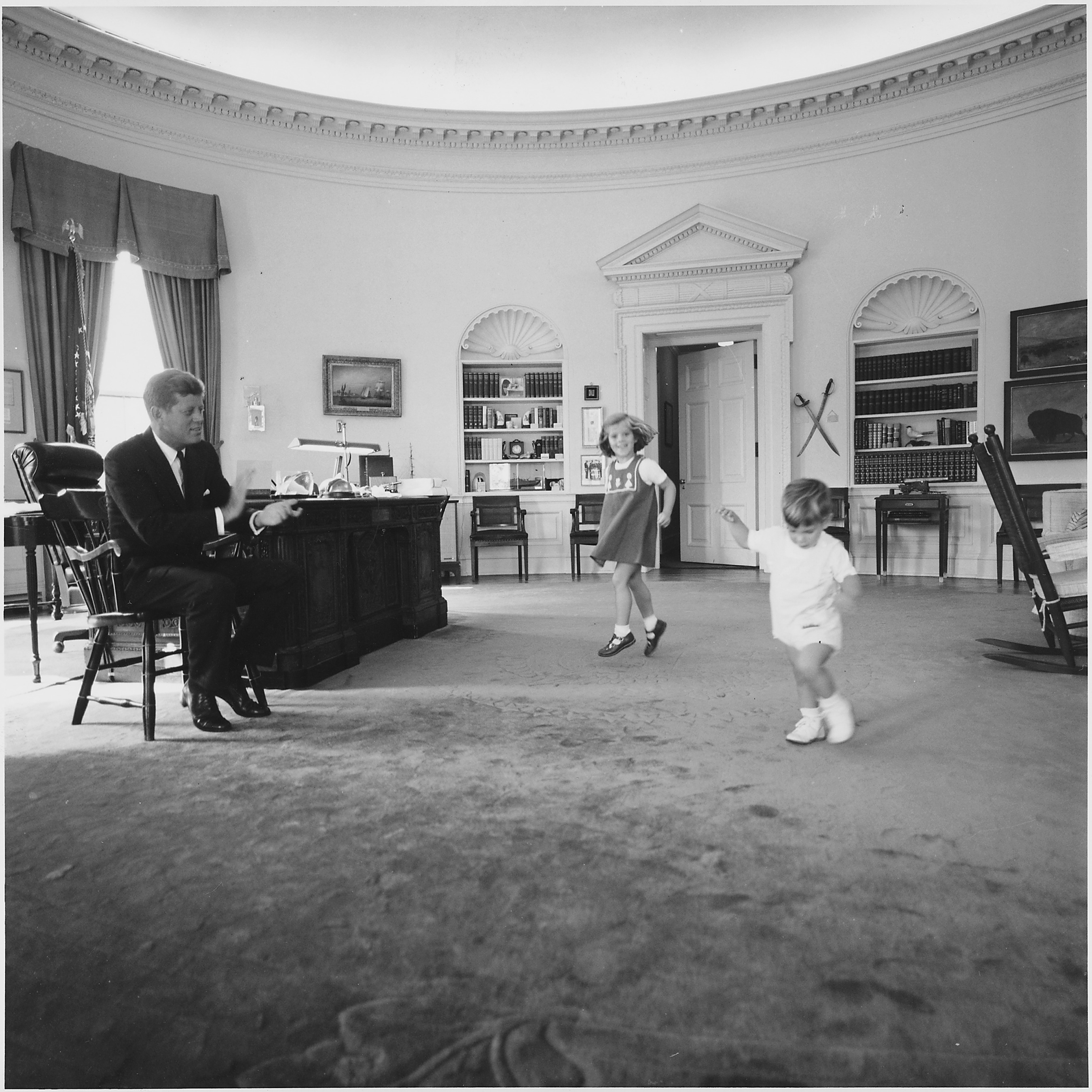 Kennedy children visit the Oval Office. President Kennedy, Caroline Kennedy, John F. Kennedy ,Jr. White House, Oval Office