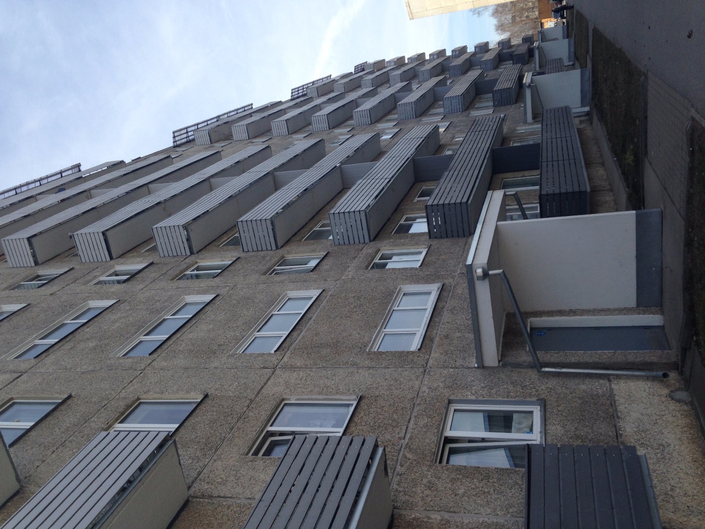 Tartu Annelinn: a close view of the 9-storey apartment, a child with three wheels on the front. rephoto