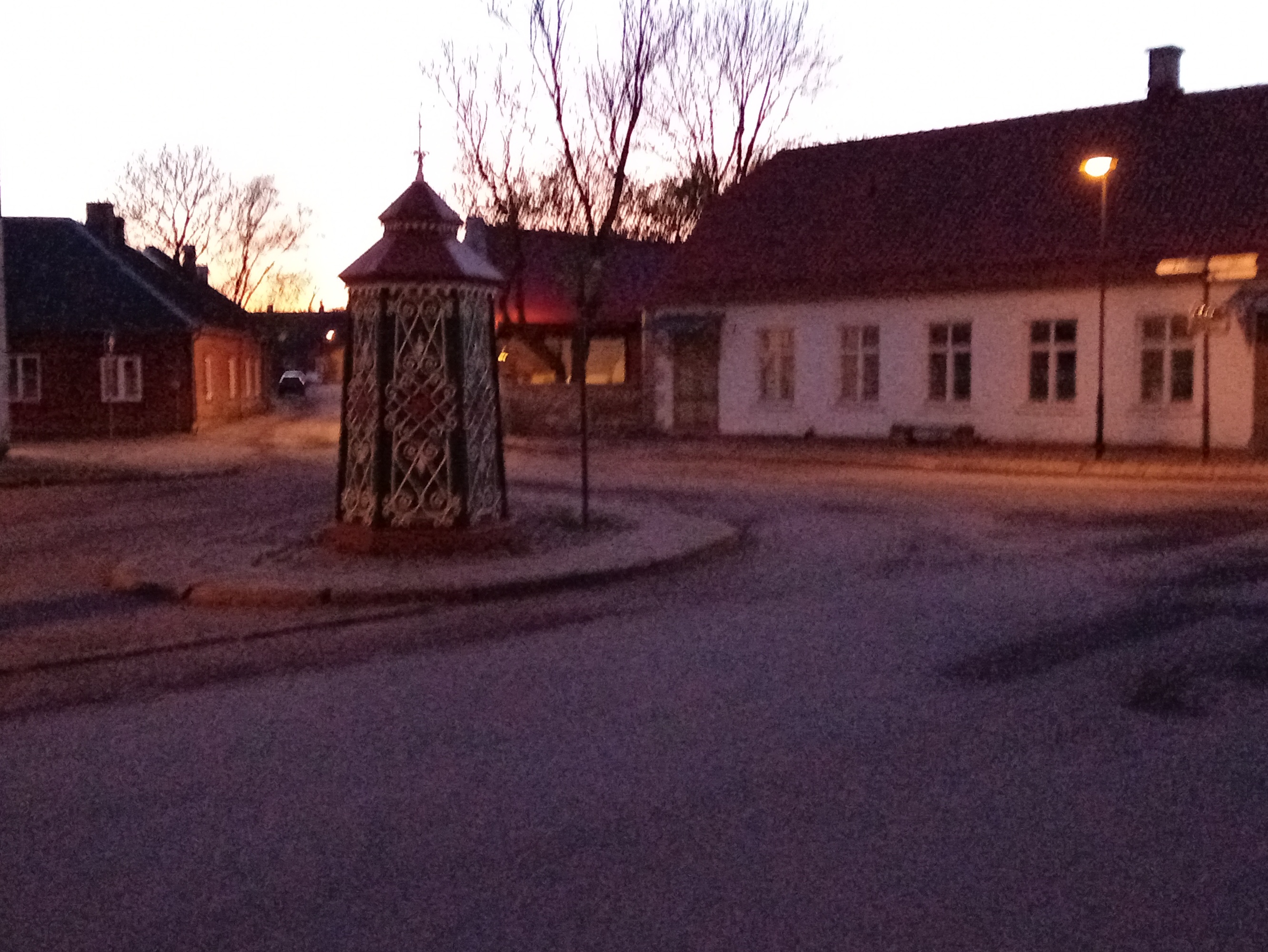 An old town yard with metal coating walls in Kingissepa. rephoto
