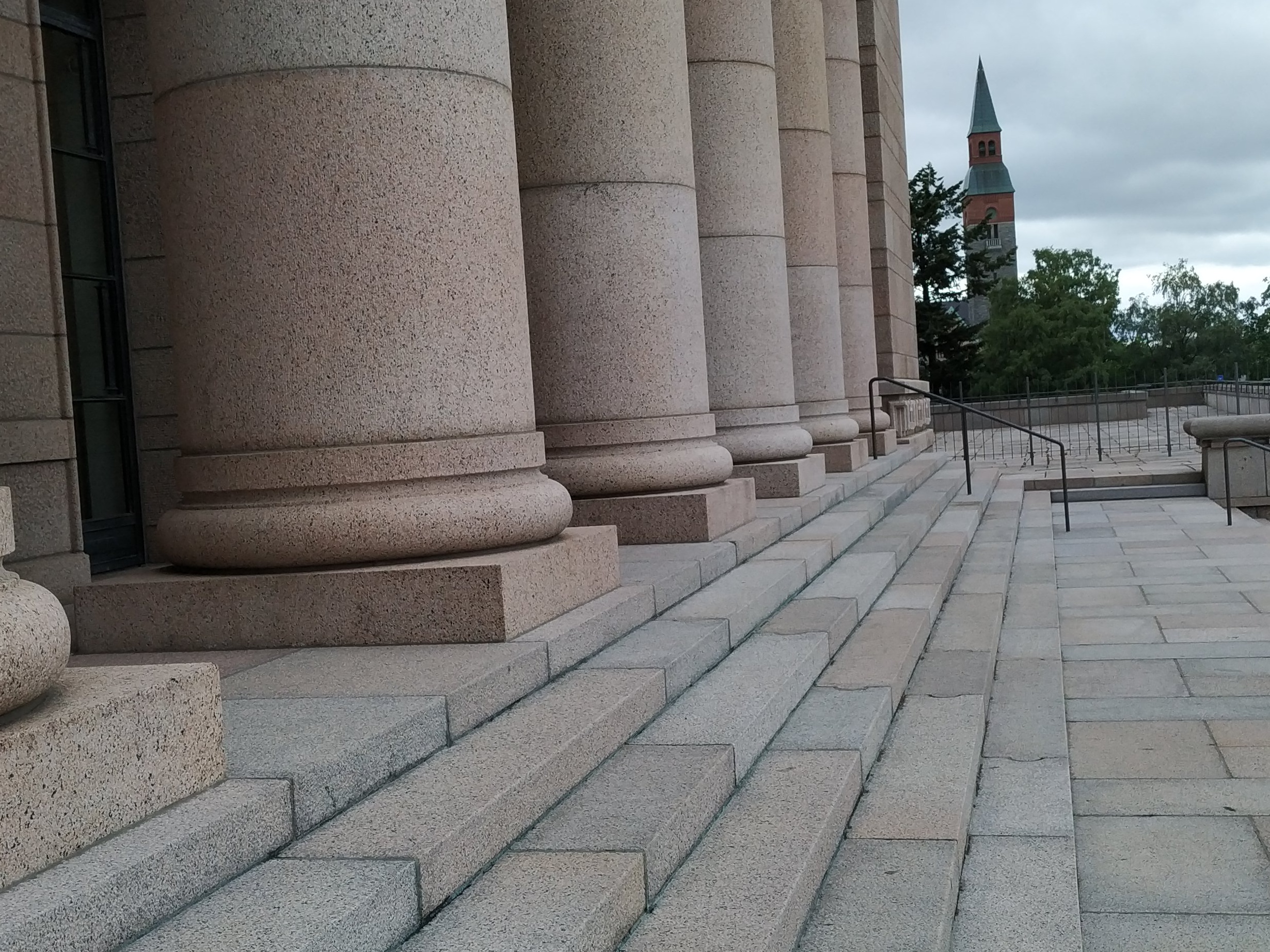 Mannerheimintie 30. Men (People?) On the stairs of the House of Representatives, following a demonstration demanding higher education democracy. rephoto