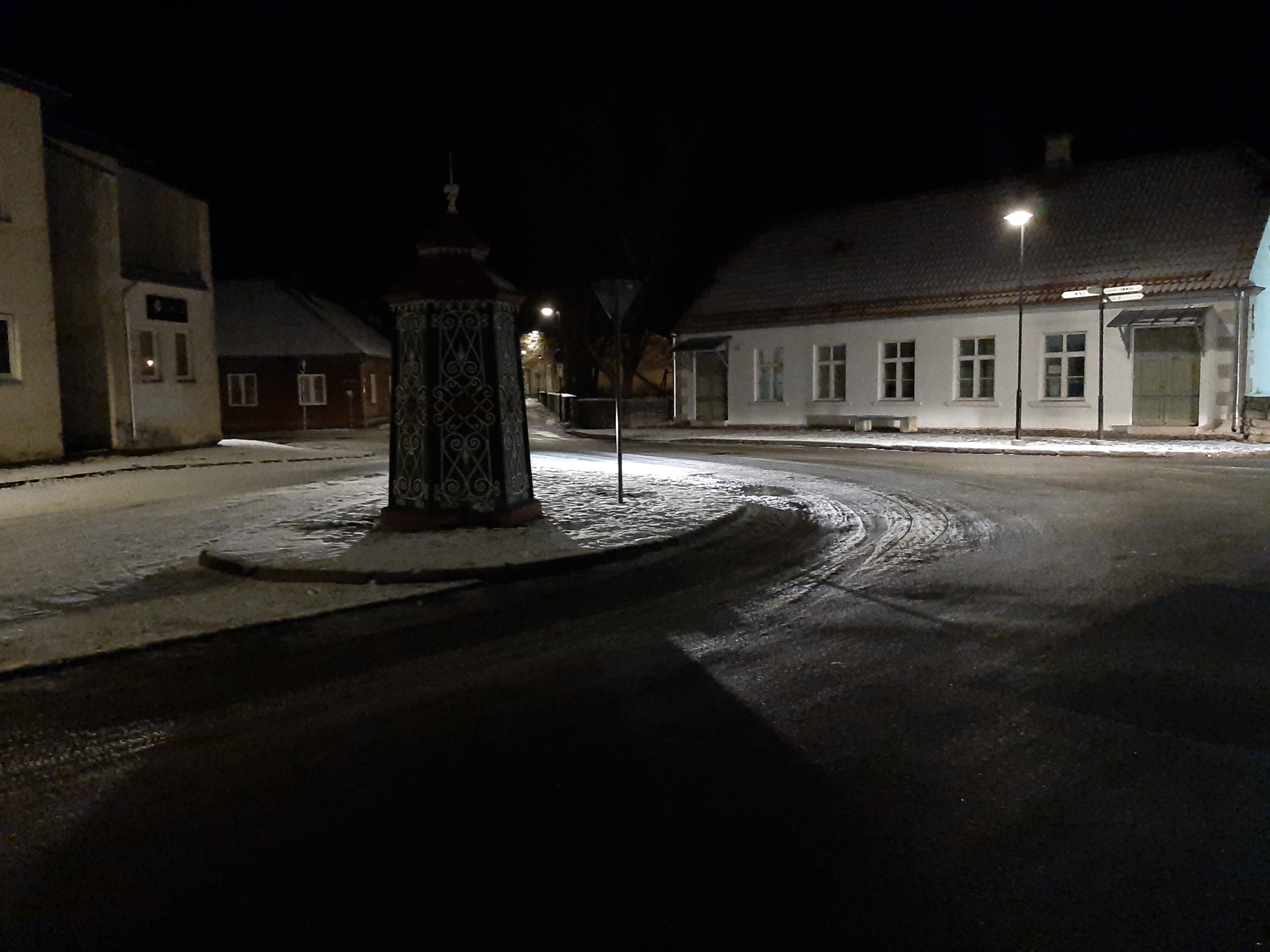 An old town yard with metal coating walls in Kingissepa. rephoto