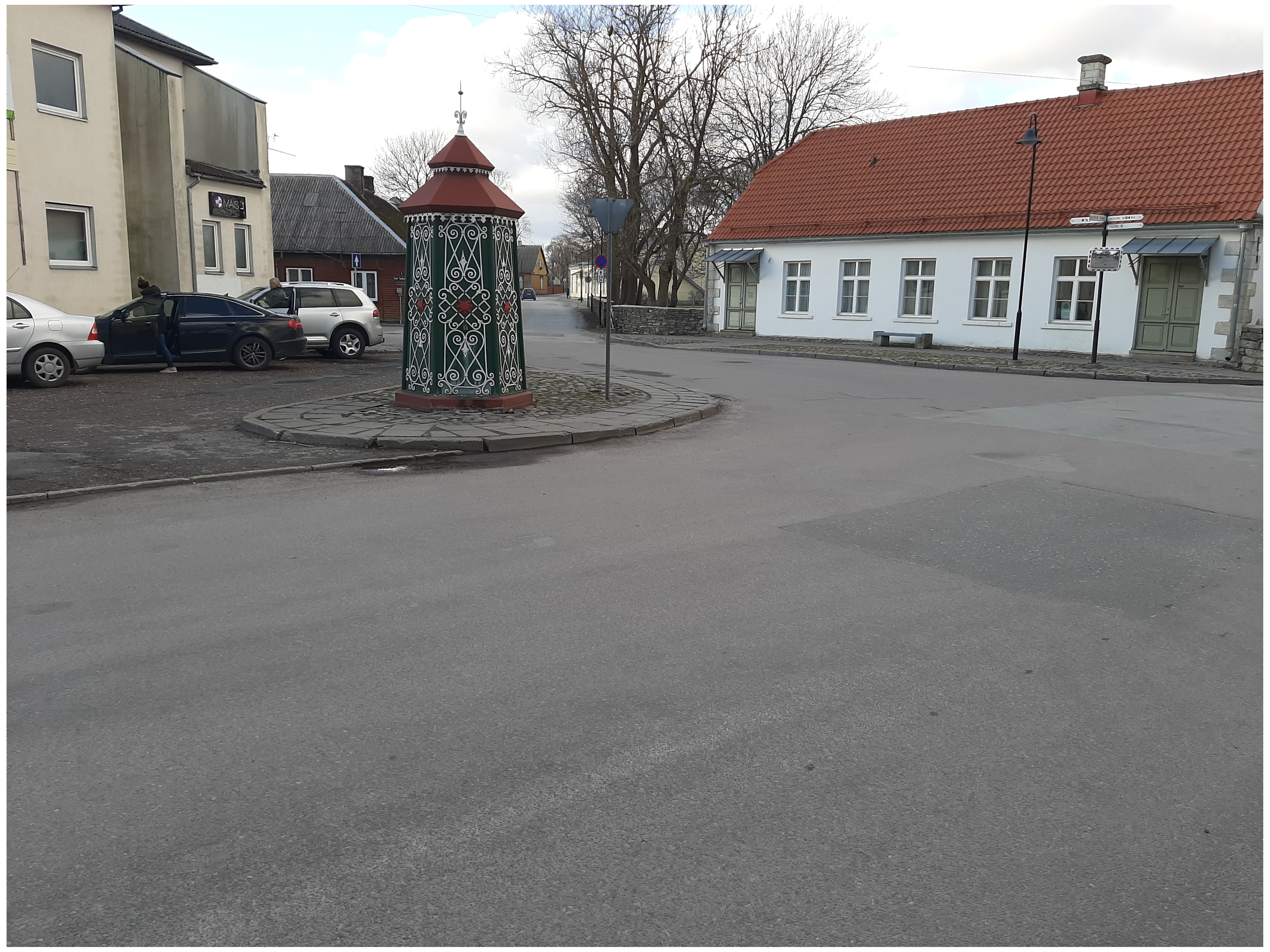 An old town yard with metal coating walls in Kingissepa. rephoto