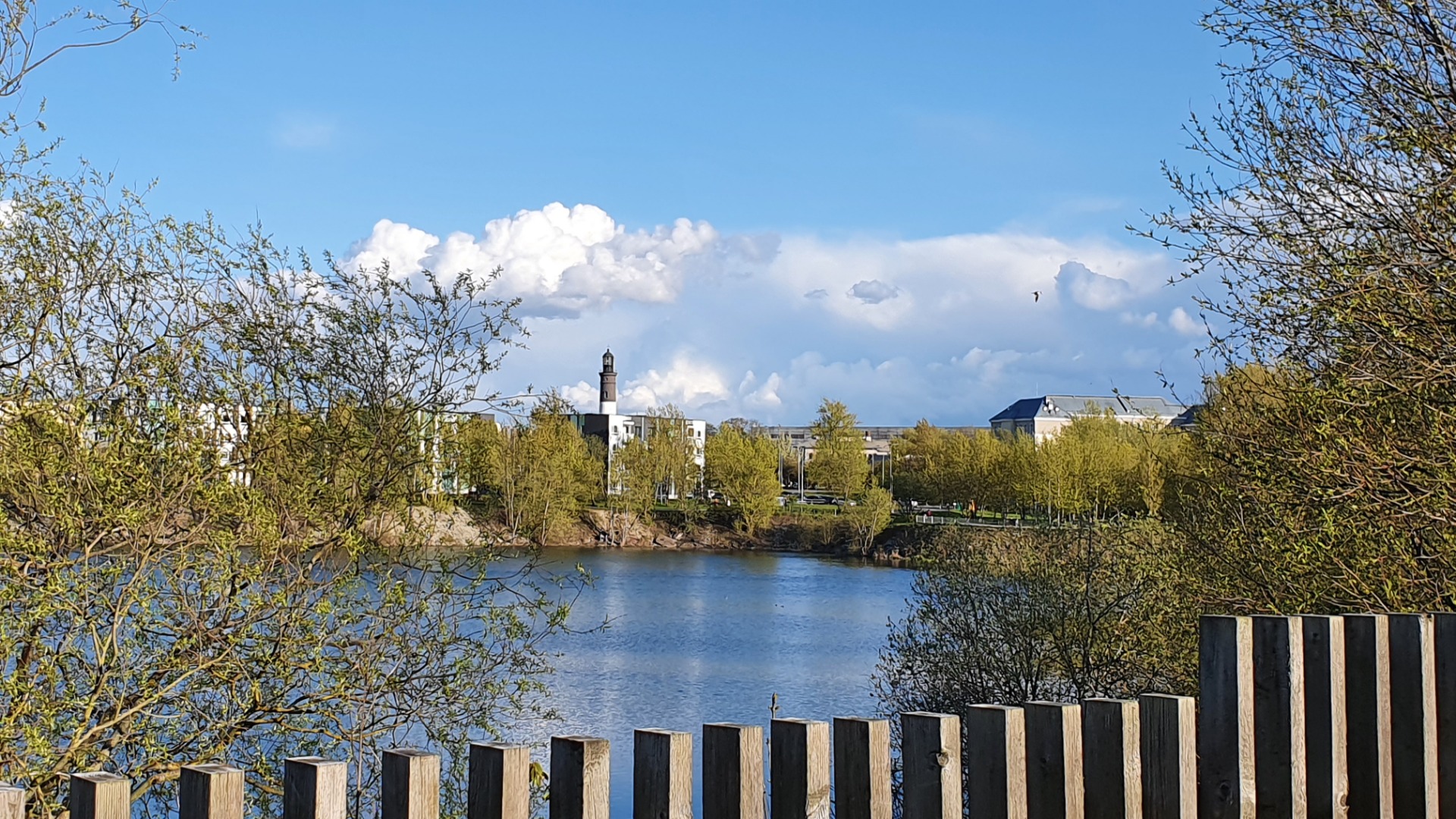 View of the Lasnamäe battery holes towards the Upper Lighthouse (Punane fire tower). rephoto