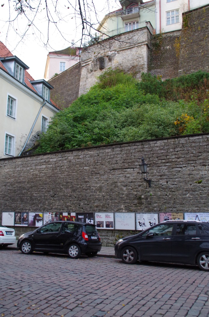 Wall with posters in the Old Town of Tallinn on Nunne Street rephoto