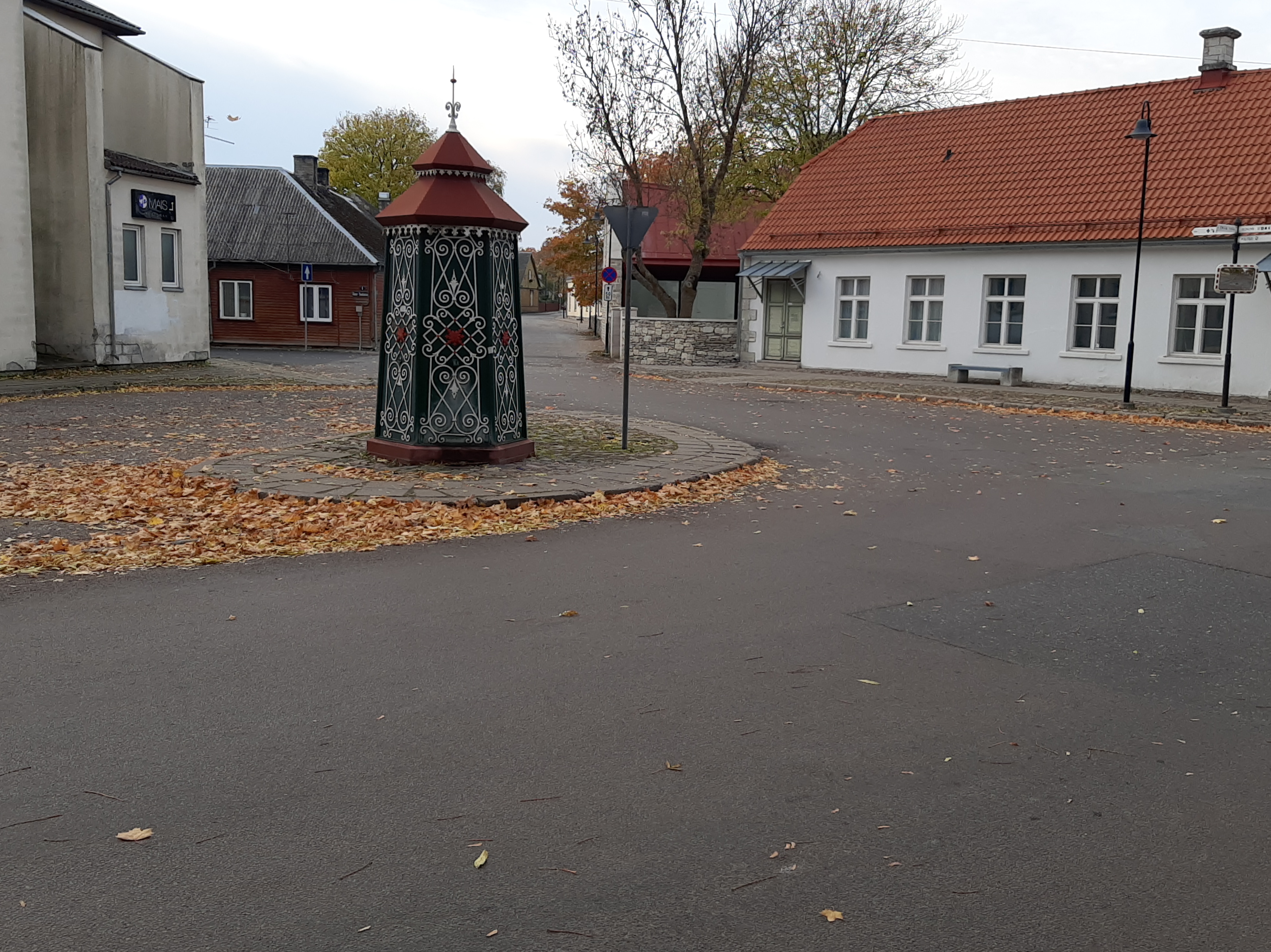 An old town yard with metal coating walls in Kingissepa. rephoto