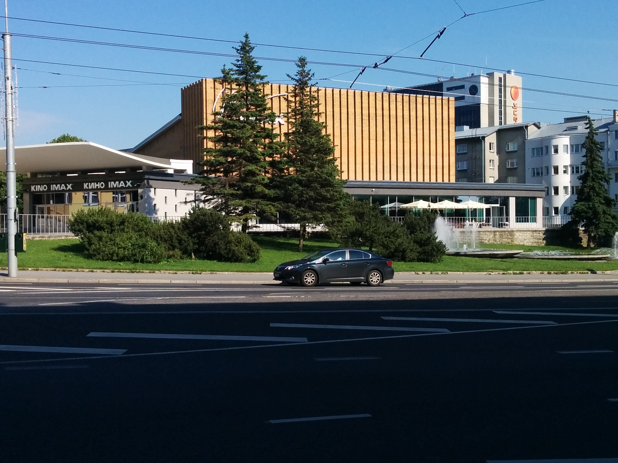 Cinema Kosmos in Tallinn, view with a car in the forefront. Architect Ilmar Laasi rephoto