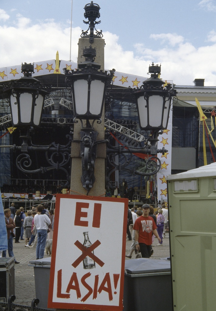 Leningrad Cowboys and the Red Army Choir at the Senate's Concert at Total Balalaika Show on Helsinki Day 1993." No glass " sign
