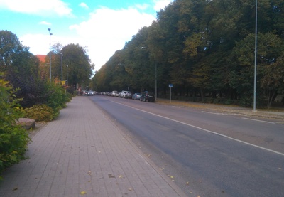 View from the Raekoja square towards the botanical garden: October (Vabaduse) puiestee, green area, bank building (Munga t 8; arh. A. Matteus). Tartu, 1964. rephoto