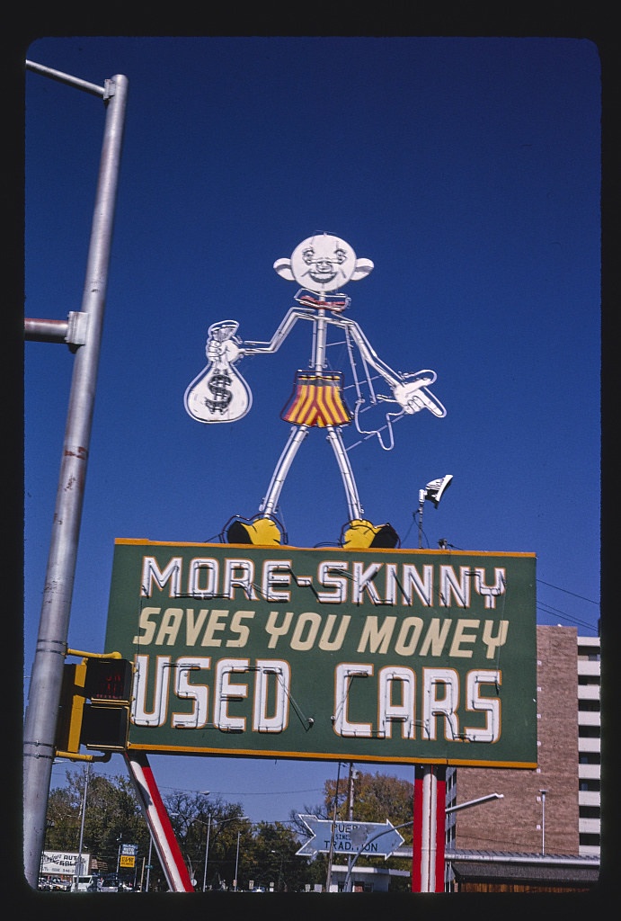 More Skinny Used Car sign, Santa Fe Avenue, Pueblo, Colorado (LOC)