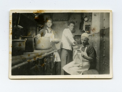 Aurulaev "Eestirand" heeringapüügil, kolm meeskonnaliiget köögitoimkonnas pliidi kõrval  similar photo