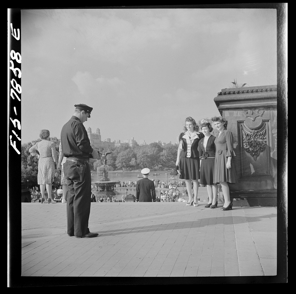 Policeman obliges three Sunday stroller in Central Park 8d22288v - New York, New York. Policeman obliges three Sunday stroller in Central Park by taking their photographs