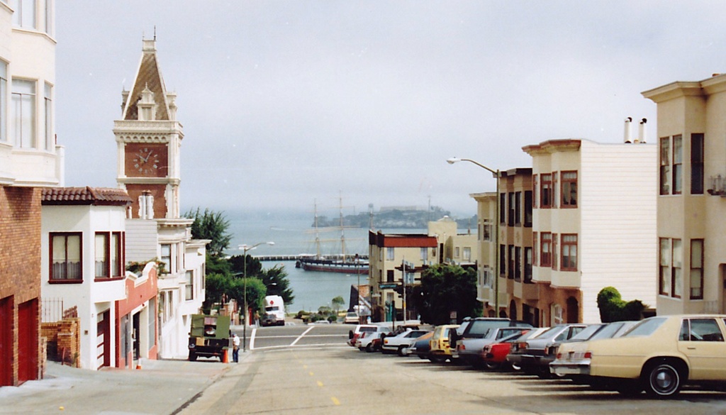 Looking to North Point St from Larkin St, SF - Larkin Street seen toward the North from near Bay Steet, with the Ghirardelli Square clock tower on the left and Alcatraz Island in the background. San Francisco,California,USA. 21 June 2011 (original upload date)