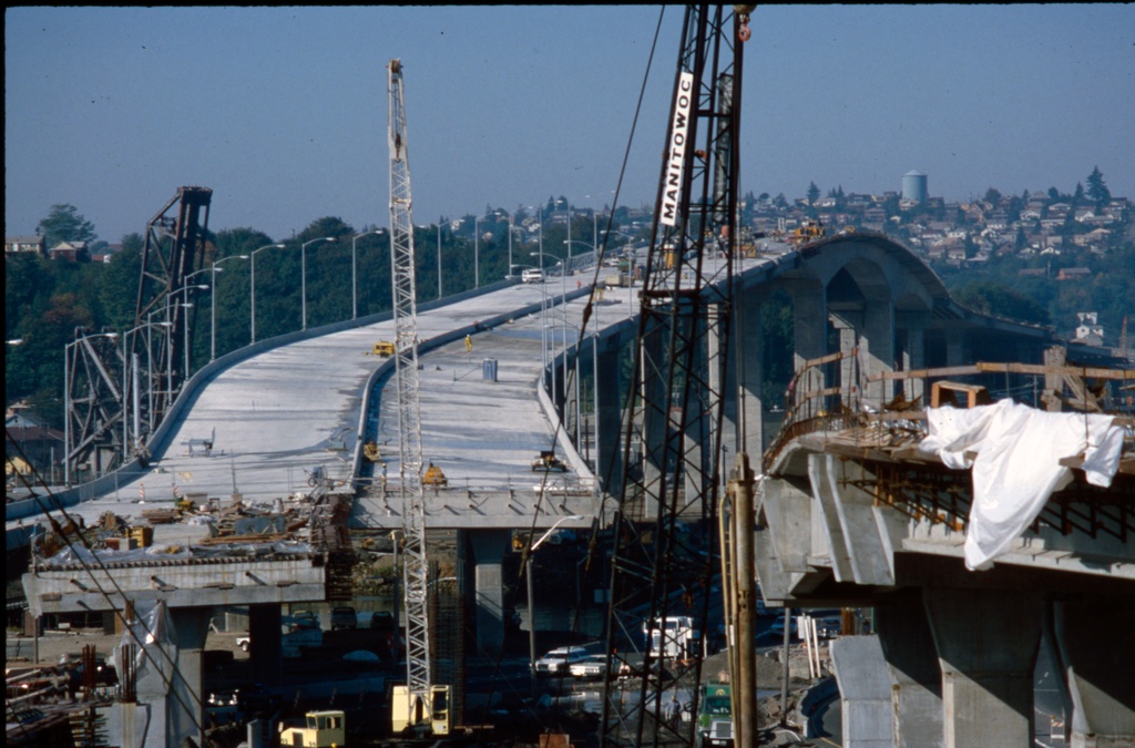 West Seattle Bridge under construction, 1983 (51343547448) - West Seattle Bridge (high bridge) under construction, Seattle, Washington, U.S., 1983. This is the one that is getting major repairs now, in 2021.