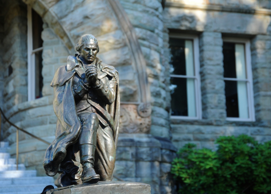 Having laid down his sword, statue of General George Washington praying, old capital building, Olympia, Washington, USA - Statue of General George Washington in front of Old Capital Building, Olympia, WA. Donated by the Freemasons September 17, 1987 to commemorate the 200th anniversary of the United States Constitution.