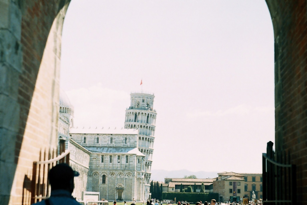 Leaning Tower - view form the entrtance - A view at the Leaning Tower in Pisa, Italy, from the entrance of the Piazza dei Miracoli.