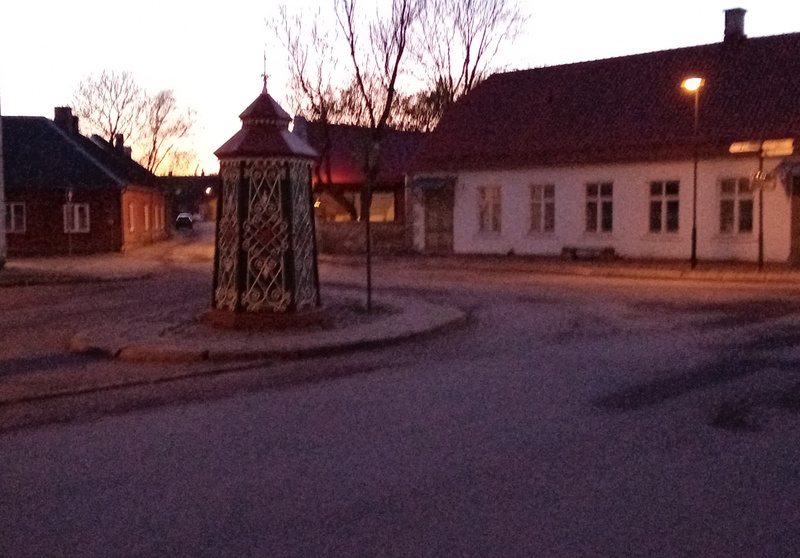 An old town yard with metal coating walls in Kingissepa. rephoto