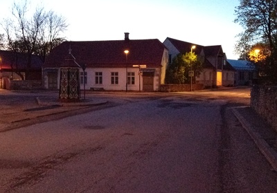 An old town yard with metal coating walls in Kingissepa. rephoto