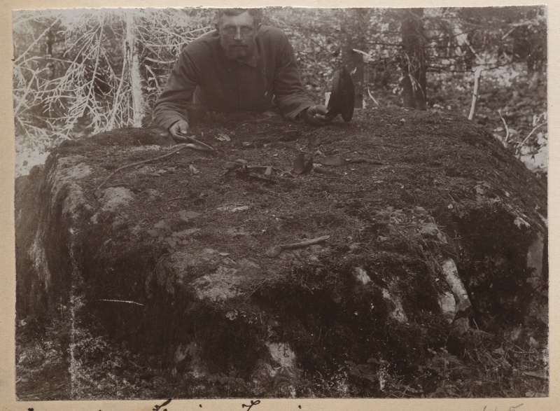 Nõiakivi in the county of Harju-Jaani, behind the stone Heinrich Tiidermann.
