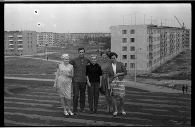 A group of people in Tallinn 37. On the roof of the high school building, the buildings of the 5th Micro district of Mustamäe. Left 2. Uno Oksbusch.  similar photo