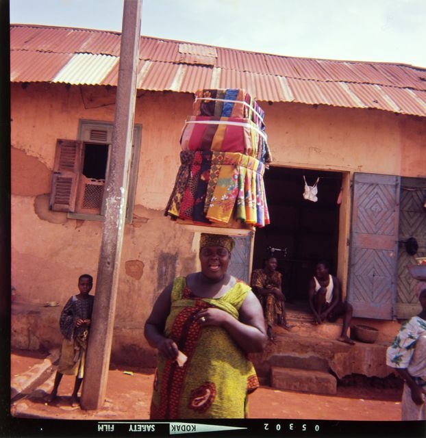 Woman selling cloth fabrics on Porto Novo Street; personal photo