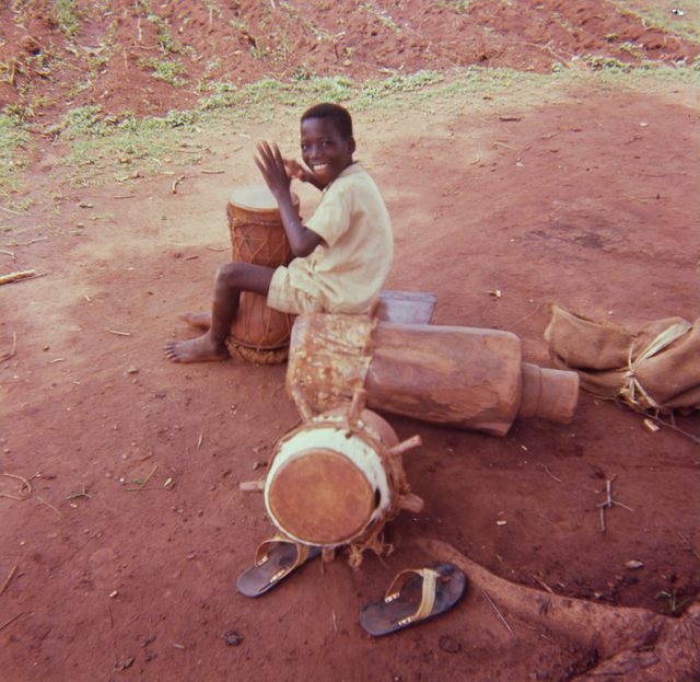 A young boy plays a humble; a personal photo